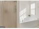 Bright bathroom with a bathtub, shower with curtain, and neutral wall and flooring at 1235 Labonte Pkwy, Mcdonough, GA 30253