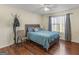 Bedroom featuring a large bed, ceiling fan, and hardwood floors at 1235 Labonte Pkwy, Mcdonough, GA 30253