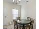 Bright dining area with neutral tones and a view of the home's entrance at 1235 Labonte Pkwy, Mcdonough, GA 30253