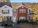 Charming townhome with brick facade, neatly trimmed bushes, and a well-maintained front lawn at 1235 Labonte Pkwy, Mcdonough, GA 30253