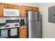 A kitchen featuring stainless steel appliances, ample cabinet space, and updated countertops at 1235 Labonte Pkwy, Mcdonough, GA 30253