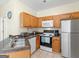 Well-lit kitchen featuring stainless steel appliances and ample cabinet storage space at 1235 Labonte Pkwy, Mcdonough, GA 30253