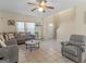 Inviting living room with neutral tones, a ceiling fan, and comfortable seating arrangement at 1235 Labonte Pkwy, Mcdonough, GA 30253