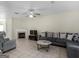 Spacious living area with a fireplace, tile flooring, and ample seating at 1235 Labonte Pkwy, Mcdonough, GA 30253