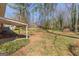 Expansive backyard featuring a partially covered patio and an additional storage shed at 437 Forrest Ave, Fayetteville, GA 30214