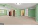 Spacious basement area with carpeting, wood paneling, and ample storage space at 437 Forrest Ave, Fayetteville, GA 30214