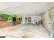Large carport area with open shelving, concrete flooring and room for work and storage at 437 Forrest Ave, Fayetteville, GA 30214