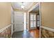 Traditional foyer features slate tile, a large front door, and views into the adjacent room through a cased opening at 437 Forrest Ave, Fayetteville, GA 30214