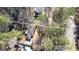 Aerial view of a home nestled among mature trees on a large lot, featuring a long, curved driveway at 437 Forrest Avenue Ave, Fayetteville, GA 30214