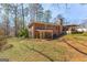 A brick home with a sprawling backyard and mature trees at 437 Forrest Avenue Ave, Fayetteville, GA 30214