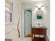 Bathroom with neutral tones, decorative tree art and a window at 437 Forrest Avenue Ave, Fayetteville, GA 30214