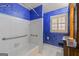 Charming bathroom with tub, tile surround, and shuttered windows and custom paint at 437 Forrest Avenue Ave, Fayetteville, GA 30214