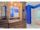 Vanity with mirror view of bathroom with tub, white tile, and shuttered windows at 437 Forrest Avenue Ave, Fayetteville, GA 30214