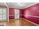 Bedroom with hardwood floors, plantation shutters, and neutral paint, creating a serene retreat at 437 Forrest Avenue Ave, Fayetteville, GA 30214