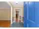 Inviting foyer featuring slate tile flooring and a partial view of a brick fireplace at 437 Forrest Avenue Ave, Fayetteville, GA 30214