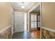 Bright foyer with slate flooring and a view into a room with shuttered windows at 437 Forrest Avenue Ave, Fayetteville, GA 30214