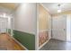 Neutral hallway with slate tile, wainscoting, and access to rooms with hardwood floors at 437 Forrest Avenue Ave, Fayetteville, GA 30214