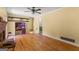 Bright living room with hardwood floors and brick fireplace with decorative storage space at 437 Forrest Avenue Ave, Fayetteville, GA 30214