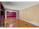 Cozy living room with hardwood floors, neutral walls, and access to another room at 437 Forrest Avenue Ave, Fayetteville, GA 30214