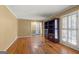 Bright living room with hardwood floors, large window, and built in shelving unit at 437 Forrest Avenue Ave, Fayetteville, GA 30214