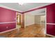 Spacious living room with hardwood floors, wainscotting, and access to kitchen at 437 Forrest Avenue Ave, Fayetteville, GA 30214
