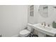 Stylish half-bath features modern sink and fixtures, with nautical themed art at 401 Hallman Pl, Peachtree City, GA 30269
