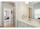 Bathroom featuring a vanity, white countertop, and views into other rooms of the house at 401 Hallman Pl, Peachtree City, GA 30269