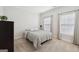Neutral bedroom with natural light, carpeted floors, and a queen-size bed at 401 Hallman Pl, Peachtree City, GA 30269