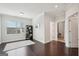 Bright, empty bedroom with hardwood floors, large window, and stylish black shelving unit at 401 Hallman Pl, Peachtree City, GA 30269