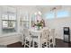 Well-lit dining area with white table, chairs, and decorative accents at 401 Hallman Pl, Peachtree City, GA 30269