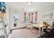 Bright home office with a door leading to the outside and comfortable seating area with lots of light at 401 Hallman Pl, Peachtree City, GA 30269