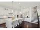 Bright kitchen featuring a large island with seating and stainless steel appliances at 401 Hallman Pl, Peachtree City, GA 30269