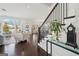 Open-concept living room with hardwood floors, staircase, and bright natural light at 401 Hallman Pl, Peachtree City, GA 30269