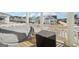 An elevated porch showcasing neighborhood views and outdoor living space with covered furniture at 401 Hallman Pl, Peachtree City, GA 30269