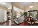 Cozy living room with hardwood floors, high ceilings, and a view of the dining area at 25 Horseshoe Ct, Covington, GA 30014