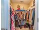 Well-organized walk-in closet with ample hanging space and shelving for efficient storage at 11157 Ash Ct, Hampton, GA 30228