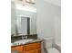 Bathroom with granite vanity, chrome fixtures, and a large vanity mirror at 473 Tufton Se Trl, Atlanta, GA 30354