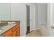 Bathroom featuring granite vanity, tile floors, and soaking tub at 473 Tufton Se Trl, Atlanta, GA 30354