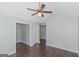 A bright bedroom features hardwood floors and a ceiling fan at 473 Tufton Se Trl, Atlanta, GA 30354