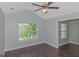 Bedroom with vaulted ceiling, ceiling fan, and view into another room at 473 Tufton Se Trl, Atlanta, GA 30354