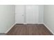 Empty bedroom with closet, wood floors, and crisp white trim and walls at 473 Tufton Se Trl, Atlanta, GA 30354