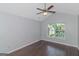 Bedroom with ceiling fan, wood floors, and double hung window at 473 Tufton Se Trl, Atlanta, GA 30354