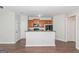 Eat-in kitchen featuring breakfast bar, modern appliances, and hardwood floors at 473 Tufton Se Trl, Atlanta, GA 30354