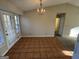 Dining room with tile flooring, a chandelier, and a door leading to the outside at 2930 David Ne Ln, Conyers, GA 30012