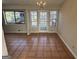 Dining area with tile flooring, a chandelier, and ample natural light from the windows at 2930 David Ne Ln, Conyers, GA 30012