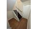 Staircase with wooden steps and white railings, connecting different levels of the home at 2930 David Ne Ln, Conyers, GA 30012