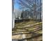Wide backyard, a perfect canvas for gardens or play areas, with a sturdy fence for privacy at 5725 Lake Windsor Pkwy, Buford, GA 30518