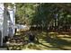Backyard featuring a patio area perfect for outdoor dining and a fenced perimeter for privacy at 5725 Lake Windsor Pkwy, Buford, GA 30518