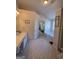 Bathroom featuring a tub, vanity with sink, closet and neutral colors at 5725 Lake Windsor Pkwy, Buford, GA 30518