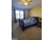 Bedroom featuring soft, neutral carpet and a ceiling fan offers a peaceful retreat at 5725 Lake Windsor Pkwy, Buford, GA 30518